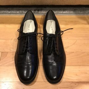 Via Spiga black leather menswear loafers.